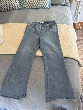 Frame Denim Washed Blue Flare Jeans with Raw Hem